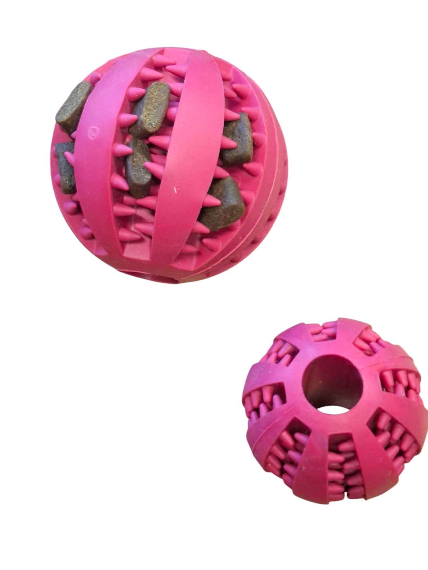 Zahnpflegeball in Pink für Hunde, mit weichen Noppen zur Zahnreinigung und Futteröffnungen zur spielerischen Beschäftigung.