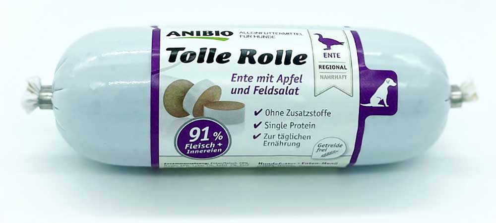 Verpackung der Anibio Tolle Rolle mit Ente, Apfel und Feldsalat, Alleinfuttermittel für Hunde mit 91 % Fleisch und Innereien